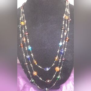 Glass multi layered jewel-toned necklace.